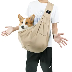 Large capacity khaki pet sling carrier shown with a dog for size perspective