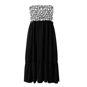 Close-up detail of strapless leopard print maxi dress featuring black ruffled tiered hem