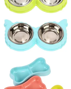 Detail view of colorful cartoon-style stainless steel double food bowls for cats and dogs