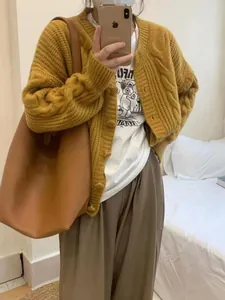 Loose mustard yellow cable knit cardigan for women, a vintage style autumn sweater
