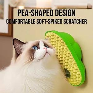 Pea-shaped wall-mounted cat self-groomer with soft silicone bristles for massage