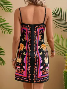Detailed back view of a black camisole dress featuring vibrant tropical digital prints.