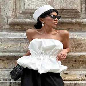 Fashionable white strapless tube top with cinched waist for chic summer outdoor wear