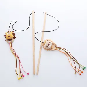 Interactive wooden cat teaser wand with plush lion head, bell and colorful tassels
