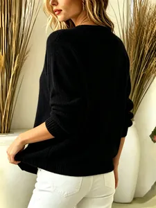 Back view of a cozy black long-sleeved knit sweater for women, perfect for winter.