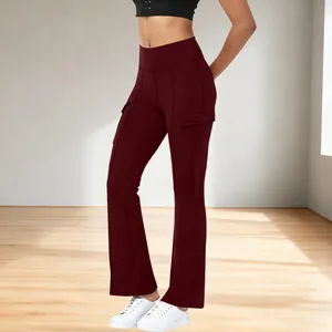 Women's high waisted burgundy flared yoga pants with side pockets in casual studio setting