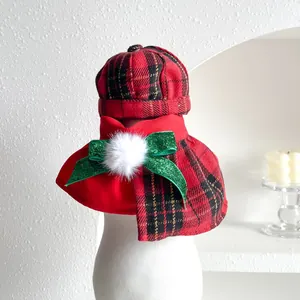 Detailed view of red plaid pet Christmas hat and bow collar set for cats and dogs