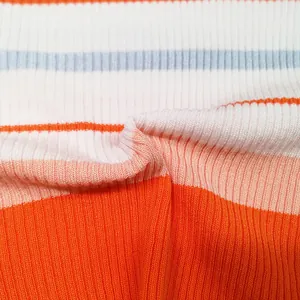 Close-up of colorful striped ribbed fabric texture for women's cropped off-shoulder T-shirt