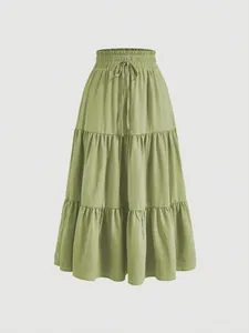 Elegant sage green tiered plus size maxi skirt with a smocked elastic drawstring waist