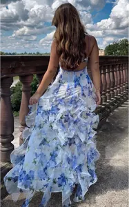 Back view of elegant floral chiffon tiered maxi dress with ruffled skirt detail