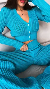 Close-up detail of blue hollow out knit two-piece set with high waist pants
