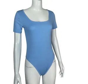 Detailed view of women's light blue ribbed short-sleeve yoga bodysuit on white mannequin