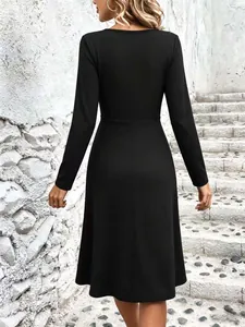 Elegant long-sleeved solid black midi dress for women shown from the back view