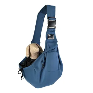 Blue foldable pet sling carrier with breathable fabric and adjustable shoulder strap