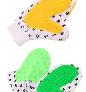 Macro view of silicone pet grooming gloves featuring textured brushes and paw print patterns.