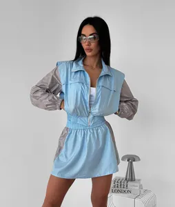 Chic blue and grey color-block women's sports set with zipper jacket and mini skirt