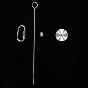 Professional stainless steel bird fruit fork and pet toy components set on black background