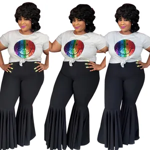Detail of plus size high waist flared pants with ruffle hem and rainbow smiley tee