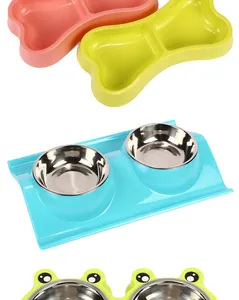 Detailed view of stainless steel pet double bowls in frog and bone shapes.