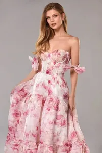 Detail of elegant pink floral organza off-shoulder evening gown for women