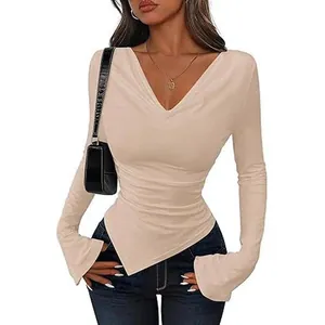 Elegant beige slim fit long sleeve top featuring asymmetrical hem and sexy cowl V-neckline