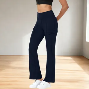 Detailed macro view of high-waisted navy blue cargo yoga pants with side pockets and flared hem
