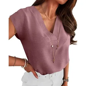 Detail view of mauve V-neck blouse showing textured fabric and elegant fit