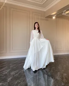 Full silhouette of an elegant white pearlescent chiffon wedding dress with lantern sleeves