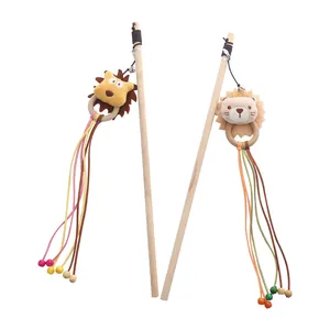 Interactive wooden cat teaser wand featuring a plush lion head and small tinkling bell