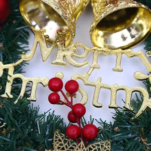 Decorative Christmas wreath with gold bells, red berries and Merry Christmas sign