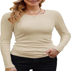 Close-up of slim-fit beige rib-knit long-sleeve T-shirt with a classic crew neck.