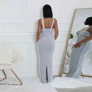 Back view of a grey two-piece bodycon dress with white trim and suspender straps