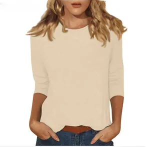 Detailed front view of women's round neck T-shirt in soft apricot with 3/4 sleeves