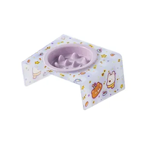 Purple ceramic slow feeder pet bowl with tilted acrylic stand and cute cartoon bear.