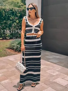 Elegant black and white striped crochet knit crop top and high waist maxi skirt set