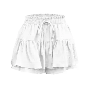 Detailed close-up of white ruffled drawstring skort showing premium fabric texture