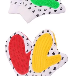 Macro detail of silicone pet bathing gloves with various scrubbing surfaces and paw prints.