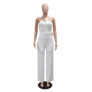 Detailed front view of a stylish white one-shoulder jumpsuit with gold bead accents