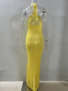 Detailed back view of a yellow knitted halter maxi beach dress with diamond knit pattern