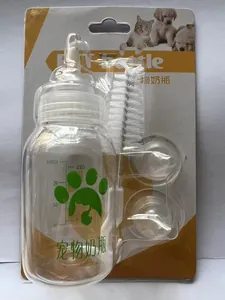 Close-up of pet nursing bottle set with cleaning brush and spare nipples in packaging