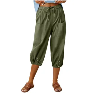 Women's casual high waisted cotton linen cropped pants with drawstring and button details.