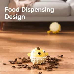 Pufferfish shaped interactive pet slow feeder toy for dogs on a modern wooden floor setting