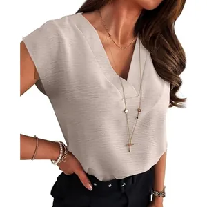 Close-up of elegant women's beige V-neck sleeveless blouse showing fabric texture