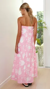 Full length back view of a pink strapless maxi dress with white eclectic graphic prints