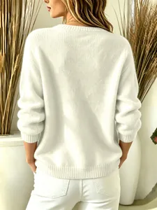 Back view of a cozy white fuzzy knit sweater showing soft texture and a relaxed fit