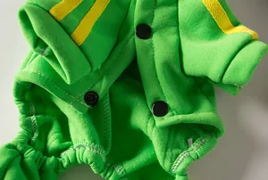 Close-up of green pet sports hoodie showing black snap buttons and fabric texture