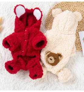 Detailed view of red and cream fleece hooded dog coats with cute bear ear designs
