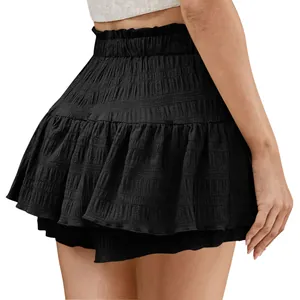 Detailed side view of black ruffled skorts featuring pleated fabric and elastic waistband