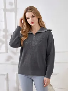Front detail of women's grey waffle-knit quarter-zip sweater with a ring pull zip