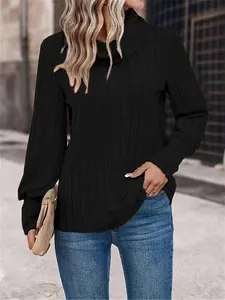 Casual black turtleneck long-sleeve top with ribbed texture on female model